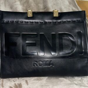 Black tote with wide strap 
See pictures for all details